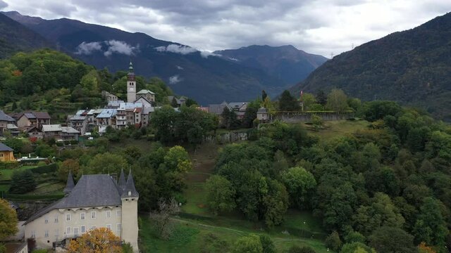 Aerial shot of the pretty old town (Conflans) overlooking Albertville, beautiful view of an old city surrounded by mountains,  View of the Conflans, the medieval city located in upper savoy, France