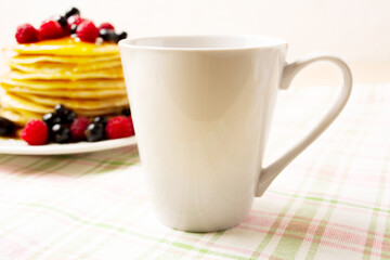 White coffee latte mug mockup with pancakes and berries