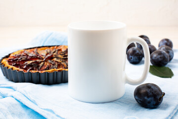 White coffee mug mockup with plum pie