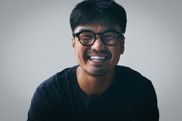 asian man portrait young male wear eye glasses smiling cheerful look thinking position with perfect clean skin posing on white background.fashion people life style concept