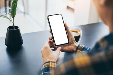 cell phone blank white screen mockup.woman hand holding texting using mobile on desk at office.background empty space for advertise.work people contact marketing business,technology