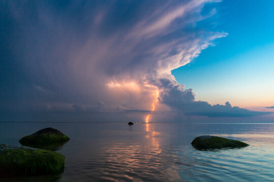 Beautiful scene with stormfront and lightning summer seascape.