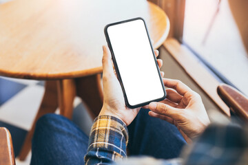 cell phone blank white screen mockup.woman hand holding texting using mobile on desk at office.background empty space for advertise.work people contact marketing business,technology