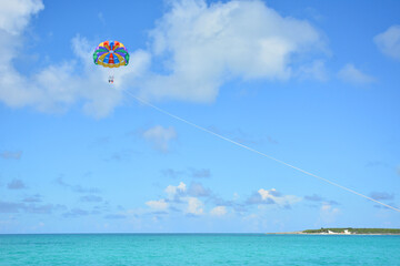 Parasailing with blue skies in the Bahamas