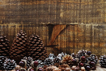 Christmas Festive background concept decoration with Christmas tree and pine cones on wooden background