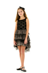 Little girl in an elegant dress.The concept of a happy childhood