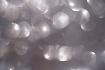 Shimmering blur spot light on silver color background, Christmas concept