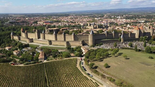 Aerial view with the discovery of the medieval city of Carcassonne. Beautiful Castle in southern France, Cite de Carcassonne. 