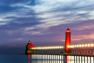 Foto op Canvas lighthouse at sunset, Grand Haven Lighthouse  © salai