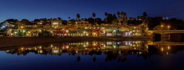 Fototapeta na wymiar Panoramic Capitola Village and Water Reflections during Blue Hour. Capitola, Santa Cruz County, California, USA.