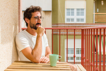 young bearded man having a coffee