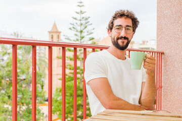 young bearded man having a coffee