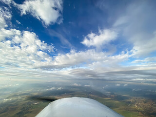 Beautiful aerial view of countryside during sunset from a Plane window