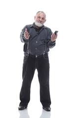 Obraz premium in full growth. friendly elderly man with a smartphone