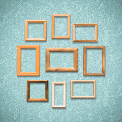 Fototapeta premium frames on old blue wall
