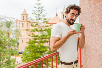 young bearded man having a coffee