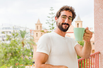 young bearded man having a coffee
