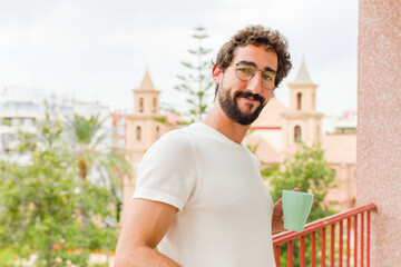 young bearded man having a coffee