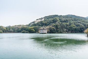 Chinese traditional pavilion next to lake in the Putuoshan mountains, Zhoushan Islands,  a renowned site in Chinese bodhimanda of the bodhisattva Avalokitesvara (Guanyin)
