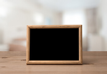 photo frame on the wooden table