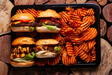 Home made hamburger with lettuce,cheese and fries potato