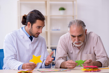 Doctor and patient suffering from Alzheimer disease