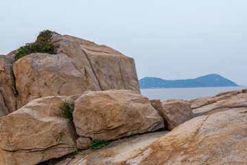 Rocks and beach in the Putuoshan, Zhoushan Islands,  a renowned site in Chinese bodhimanda of the bodhisattva Avalokitesvara (Guanyin)