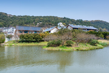 Chinese traditional hotels next to lake in the Putuoshan mountains, Zhoushan Islands,  a renowned site in Chinese bodhimanda of the bodhisattva Avalokitesvara (Guanyin)