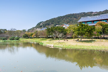 Chinese traditional hotels next to lake in the Putuoshan mountains, Zhoushan Islands,  a renowned site in Chinese bodhimanda of the bodhisattva Avalokitesvara (Guanyin)