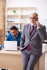 Two male colleagues working in the office