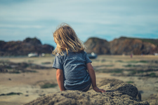 Preschooler playng on the beach