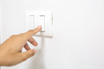 A woman's finger is pressing a switch  and copy space