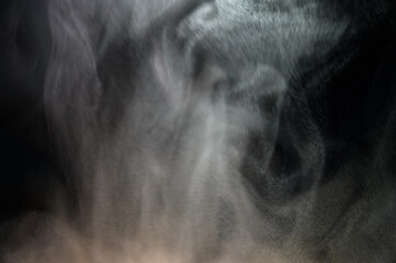 Grey smoke on a black background, fog on a dark background