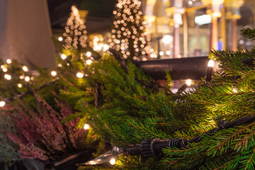 Christmas lights on the tree, background of the fossad of an old building
concept, postcard,...