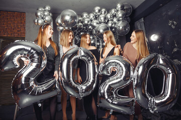 Fototapeta na wymiar Group have fun. New years theme. Friends with ballons.