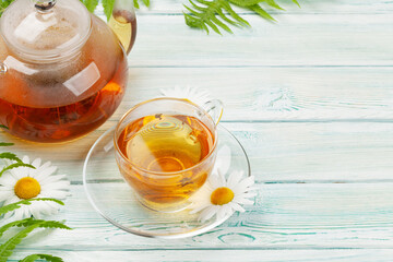 Herbal tea in teapot and cup