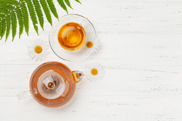 Herbal tea in teapot and cup