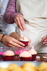 Couple making cupcakes
