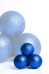 Blue Christmas baubles on a white background.