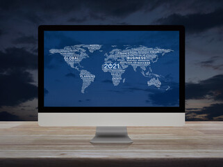 Start up business flat icon with global words world map on desktop modern computer monitor screen on wooden table over sunset sky, Happy new year 2021 global business start up concept, Elements of thi