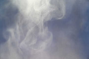 Gray smoke on a blue background, fog on a dark blue background