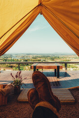 young Thai teen boy brunette tourist adult man asian mature sitting looking into the sky outdoors on a hike mountains viewpoint at chiang mai, mon jam, Thailand.