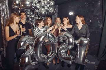 Fototapeta na wymiar Group have fun. New years theme. Friends with ballons.