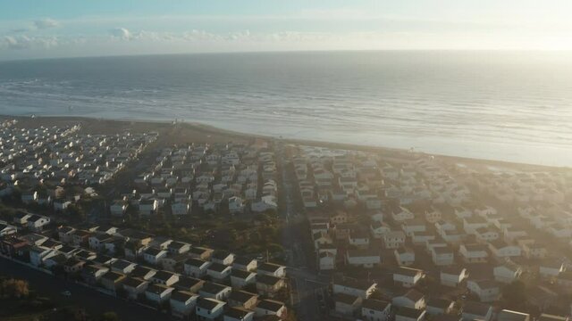 Mediterranean seaside town with beautiful sunrise, early morning. Aerial footage located in Gruissan at the famous beach "Plage des Chalets", 