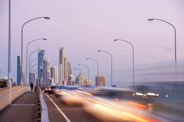 Bridge with traffic and pedestrian walkway and cycle path leading into Surfers Paradise city