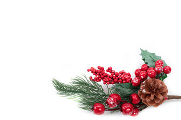 On a white background, a Christmas tree decoration: a spruce branch with a pine cone and red berries. Christmas background.