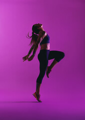 Obraz na płótnie Canvas Fit woman doing stretching workout