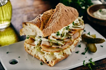 Zelfklevend Fotobehang Freshly baked crusty baguette ham sandwich © exclusive-design