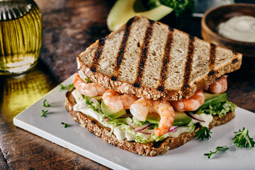 Toasted sandwich with prawns and avocado pear