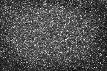 Dark  black gravel small texture decorative on concrete wall abstract  background